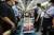전국장애인차별철폐연대(전장연) 회원들이 지난 7월 4일 오전 서울 삼각지역에서 지하철 4호선에 탑승하며 출근길 시위를 벌이고 있다. 뉴스1 