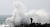 (제주=뉴스1) 고동명 기자 = 제11호 태풍 '힌남노'가 점차 북상하고 있는 4일 제주 서귀포시 안덕면 사계리 해안에서 한 행인이 거대한 파도를 사진으로 담고 있다. 뉴스1