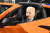 14일(현지시간) 미국 미시간주 디트로이트에서 열린 2022 북미 오토쇼에 참석한 조 바이든 미국 대통령이 미 자동차 브랜드 쉐보레의 콜벳 자동차에 탑승해 보고 있다. AFP=연합뉴스