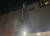  제14호 태풍 '난마돌'의 북상으로 18일 오후 6시 50분께 사천시 동금동 한 식자재마트 간판이 흔들린다는 신고가 접수돼 소방대원이 안전조치하고 있다. 경남소방본부 제공. 