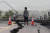 19일(현지시간) 한 시민이 화롄현 위리 지역 도로 붕괴현장을 바라보고 있다. EPA=연합뉴스