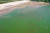 지난달 12일 오후 부산 사하구 다대포해수욕장 바닷물이 초록빛을 띄고 있다. 낙동강에서 떠내려온 녹조로 인해 다대포 해수욕장 입수가 5년 만에 금지됐다. 연합뉴스