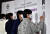 방탄소년단이 지난 7월 19일 서울 용산구 하이브 본사에서 열린 2030 부산세계박람회 홍보대사 위촉식에서 사인을 하고 있다. 사진 뉴스1