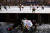 지난 1일 중국 랴오닝성 안산시의 얼어붙은 호수에서 50~60대 남성들이 생활체육으로 아이스하키를 하고 있다. [로이터=연합뉴스]