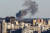 지난달 31일 러시아군의 미사일 공습으로 연기가 치솟는 우크라이나 수도 키이우 시내. 로이터=연합뉴스