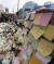 1일 오전 서울 용산구 이태원역 1번 출구 앞에 마련된 핼러윈 참사 추모 공간에 시민들이 놓고 간 꽃과 메시지가 놓여 있다. [연합뉴스]
