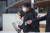 지난해 12월 9일 대규모 환불 사태를 일으킨 머니포인트의 운영사 권남희 머지플러스 대표(왼쪽)와 그의 동생 권보군 최고운영책임자가 영장실질심사를 받기 위해 서울 양천구 남부지법으로 출석하고 있는 모습. 뉴스1