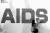 지난 2011년 한국에이즈퇴치연맹 관계자가 에이즈를 방지를 위한 퍼포먼스를 벌이기 위해 붉은 콘돔으로 `AIDS' 글자를 만들고 있다. 연합뉴스 