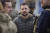 지난 14일 볼로디미르 젤렌스키 우크라이나 대통령이 최근 러시아로부터 탈환한 남부 도시 헤르손을 방문한 모습. AP=연합뉴스