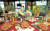  지난 7일 서울 종로 그랑서울에서 진행한 BBQ의 하반기 전략 신제품 ‘자메이카 소떡만나 치킨’ 론칭 발표회 모습. [사진 제너시스BBQ]