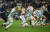 리오넬 메시(왼쪽)가 오랜 꿈이던 아르헨티나의 월드컵 우승이 확정된 순간, 그라운드에 무릎을 꿇으며 환호하고 있다. [로이터=연합뉴스]