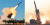 왼쪽부터 무인표적기를 향해 발사되는 한국 패트리엇 미사일, 북한이 지난해 11월 발사한 초대형 방사포. [중앙포토, 연합뉴스]