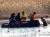 오프로드 차를 몰다 늪에 빠졌던 신고자 3명이 구조되고 있다. 사진 부산경찰서=연합뉴스