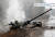 26일 우크라이나 루간스크 지역 도로에 파괴된 러시아 탱크. 러시아는 개전 초기 병참에 차질을 빚고 있다는 분석이 나온다. [AFP=연합뉴스]
