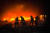 10일(현지시간)러시아의 공습으로 우크라이나의 한 건물이 불에 타자 소방대원들이 진화 작업을 벌이고 있다. UPI=연합뉴스