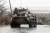 친 러시아 군대의 장갑차 행렬이 13일 비가 내리는 가운데 마리우폴 도로를 지나고 있다. 로이터=연합뉴스