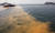 지난 2018년 7월 적조주의보가 발령된 전남 여수시 남면 화태도 해상에서 양식장 피해 방지를 위해 바다에 황토를 뿌리고 있다.[뉴스1]