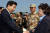 2003년 4월 28일 서울시 송파구 특수전 사령부에서 열린 서희부대와 제마부대의 이라크 파병신고및 환송행사 에서 노무현 전 대통령이 파병지휘관 및 장병 가족들을 격려하고 있다.
