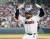 두산 로하스가 1일 롯데와의 개막전에서 연장 11회 말 끝내기 3점 홈런을 친 뒤 더그아웃을 향해 환호하고 있다. 뉴스1