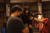 영화 '길복순'의 액션 촬영 장면. 몸에 와이어를 매단 전도연이 스태프가 보여주는 화면을 들여다보고 있다. 사진 넷플릭스