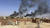 지난 21일(현지시간) 군벌 간 유혈 충돌로 수천 명의 사상자가 발생한 북아프리카 수단의 수도 하르툼의 도하국제병원 인근 건물들에서 검은 연기가 피어오르고 있다. [AP=연합뉴스]