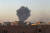 수단 수도 하르툼의 국제병원 근처에서 검은 연기가 치솟고 있다. AP=연합뉴스