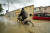 17일(현지시간) 이탈리아 에밀리아-로마냐주 주도 볼로냐 인근 지역의 침수된 거리에서 한 남성이 자전거를 타고 있다. AP=연합뉴스