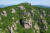 드론으로 촬영한 남해 금산 보리암. 금산 중턱 바위 위에 위태로이 서 있다. 사진 남해군 관광문화재단
