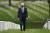 지난 4월 조 바이든 미국 대통령이 버지니아주 알링턴 국립묘지를 돌아보고 있다. 바이든은 이날 아프가니스탄 주둔 미군 약 2500명을 9·11테러 20주년인 9월 11일까지 모두 철수하는 계획을 발표한 뒤 이곳을 찾았다. AP=연합뉴스