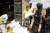허남운 굿네이버스 케냐 대표(왼쪽에서 두 번째)가 케냐 북부 마사빗(Marsabit) 지역 주민들에게 옥수수가루와 콩, 쿠킹오일 등으로 구성된 긴급 식량을 배분하는 모습. [사진 제공=굿네이버스]