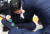 더불어민주당 장경태 최고위원이 14일오전 과천 방송통신위원회를 항의 방문해 성명서를 읽던 중 쓰러진 뒤 일어나 손으로 얼굴을 감싸고 있다. 연합뉴스