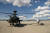 미국 육군의 AH-64 아파치 공격헬기(왼쪽)와 MQ-1C 그레이이글 무인기. AH-64는 MQ-1C를 조종할 수 있다. 위험한 지역에 먼저 보내 정찰ㆍ공격을 하면 헬기의 생존성을 높일 수 있다. GA-ASI
