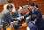 진보당 강성희 의원이 10일 오후 국회 본회의장에서 열린 전원위원회 전 더불어민주당 의원들과 인사하고 있다. [연합뉴스]