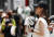무더운 날씨를 보인 19일 서울 명동거리에서 관광객들이 손풍기를 들고 걷고 있다. 뉴스1