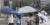 21일 서울 시내 한 거리에서 우산을 쓴 시민들이 발걸음을 옮기고 있다. 뉴스1