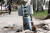 지난해 4월 루한스크 지역 리시찬스크의 한 도로에 집속탄이 들어 있는 것으로 보이는 300mm 로켓의 미폭발 꼬리 부분이 박혀 있다. AFP=연합뉴스