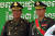 훈센 캄보디아 총리와 그의 장남 훈 마넷 차기 총리가 나란히 군복을 입고 서 있는 모습. AFP=연합뉴스