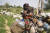 이달 중순 나이지리아의 유목민 어린이들이 당나귀를 타고 이동하는 모습. [AP=연합뉴스]