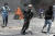 7일(현지시간) 아이티 포르투프랭스에서 시위 참가자가 경찰이 발사한 최루탄을 피해 달리고 있다. AP=연합뉴스