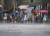 8일 오후 일본 가고시마현에서 행인들이 폭우가 쏟아지는 거리를 걷고 있다. AP=연합뉴스 