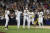 김하성(오른쪽에서 두 번째)이 22일(한국시간) 마이애미전 2회 1사 만루에서 MLB 데뷔 후 첫 그랜드슬램을 터트린 뒤 홈에서 동료들과 하이파이브하고 있다. AP=연합뉴스