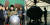 북한이 2016년 3월 공개한 사진(왼쪽)에서 김정은 국무위원장이 내폭형 핵 기폭장치를 점검 중이다. 오른쪽은 영화 ‘오펜하이머’의 핵폭탄 운반 직전 장면. [노동신문=연합뉴스, 유니버설 픽쳐스]