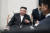 김정은 북한 국무위원장이 지난 12일 러시아 연해주 하산역에 도착해 알렉산드로 코즐로프 러시아 천연자원생태부 장관의 영접을 받고 있다. AP=연합뉴스