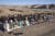 8일(현지시간) 아프간인들이 헤라트주에서 지진 사망자를 매장한 뒤 애도하고 있다. AP=연합뉴스