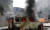 7일(현지시간) 이스라엘 아슈켈론 시내에서 무장정파 하마스의 로켓 공격을 받은 차량이 불타고 있다. EPA=연합뉴스