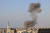 지난 11일(현지시간) 이스라엘의 공습으로 인해 가자 지구 내 모스크에서 연기가 피어오르는 모습. AFP. 연합뉴스.