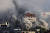 11일(현지 시간) 이스라엘군의 공격을 받은 가자지구 내 건물에서 연기가 피어오르고 있다. 연합뉴스