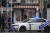 벨기에 경찰이 17일(현지시간) 브뤼셀에서 총격 사건 용의자를 사살한 뒤 통제된 구역에 서 있다. AP=연합뉴스