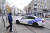 17일(현지시간) 벨기에 브뤼셀에서 발생한 총격 사건 용의자가 사살된 지역 근처에 경찰차가 세워져 있다. AFP=연합뉴스