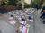 24일(현지시간) 미국 뉴욕 유엔본부 인근의 한 광장에 하마스가 납치한 인질들의 사진과 함께 이들의 신발이 놓여 있다. [사진 X 캡처]